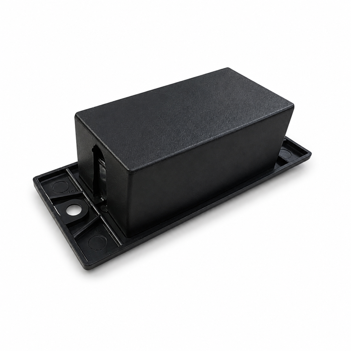Rear view of the push button switch housing on its black surface-mount plate