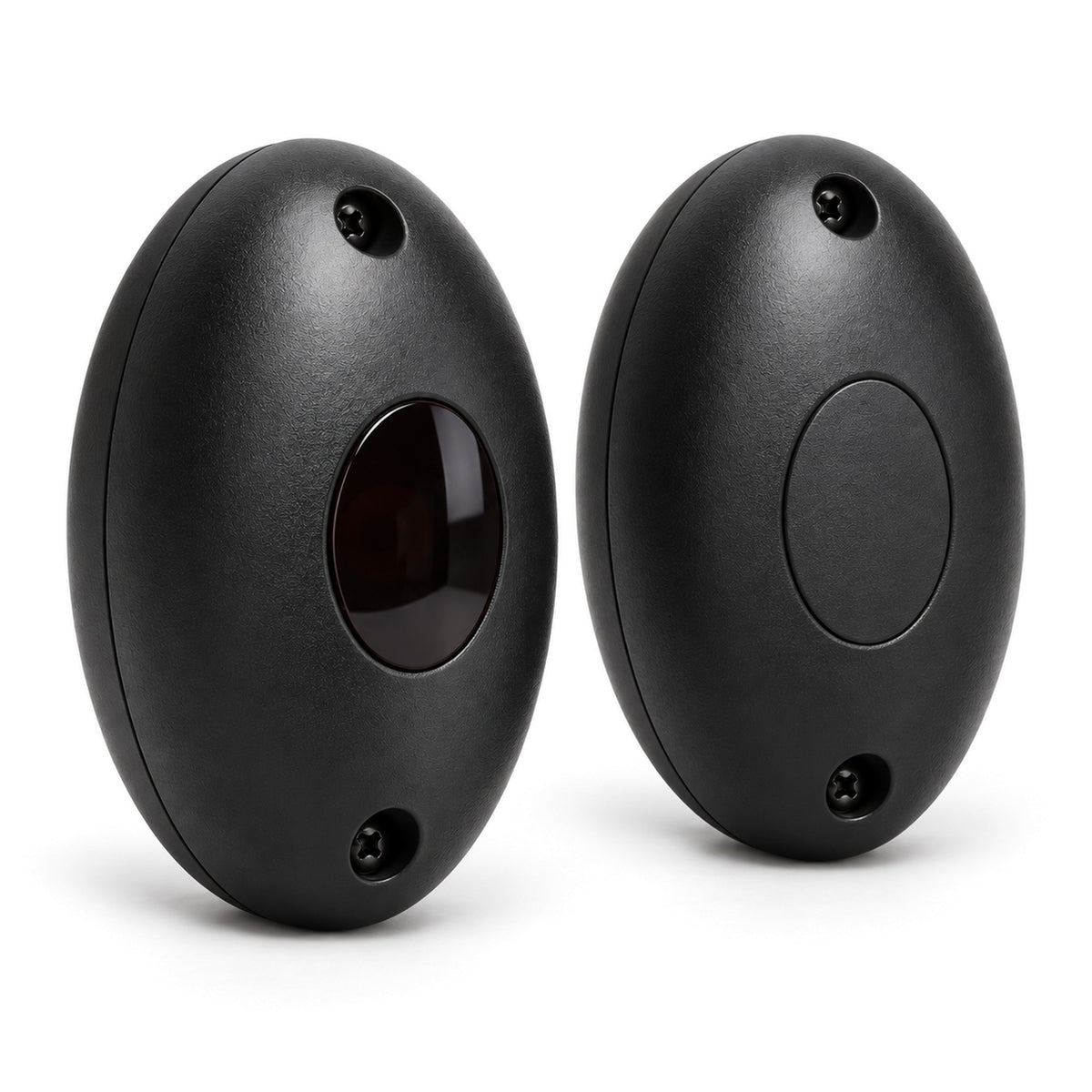 Infrared safety beam sensor pair at a three-quarter angle, showing the matte black oval housings, the infrared lens on the transmitter and the mounting screw holes
